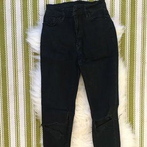 Black ripped jeans with holes at knees